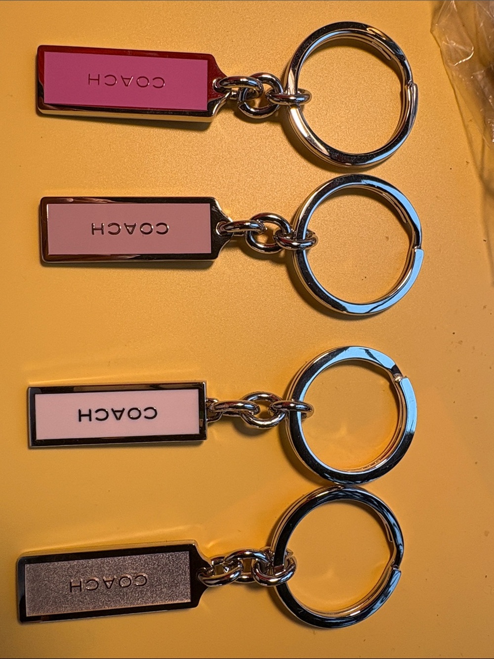 Coach Set of 4 Metal Key Tags in Hot Pink, Light Pink, Blush & silver